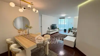 Stylish living room with modern dining area and cozy seating, perfect for entertaining.