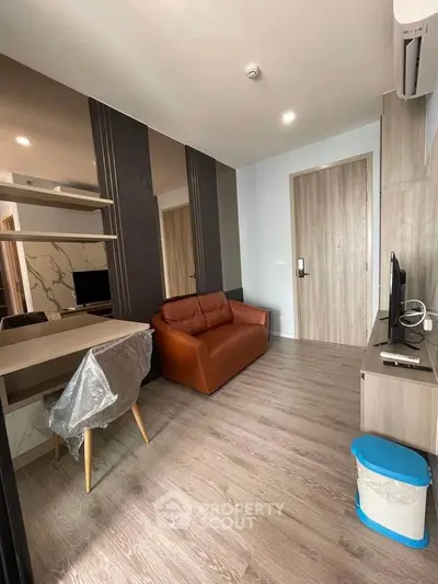 Modern living room with sleek furniture and stylish decor in a contemporary apartment.