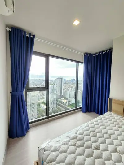 Modern bedroom with stunning city view and large windows