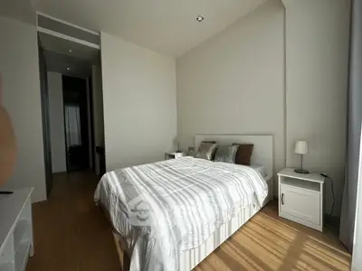 Spacious modern bedroom with natural light and minimalist decor