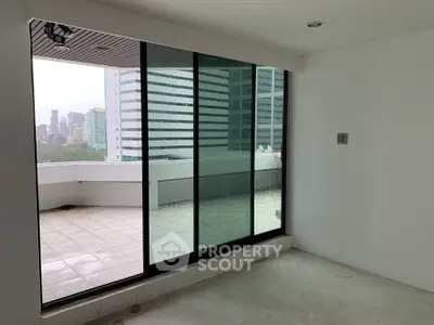 Spacious balcony with city skyline view in modern apartment