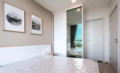 Modern bedroom with minimalist decor and large sliding closet doors