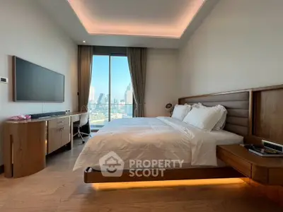 Luxurious bedroom with city view, modern furnishings, and ambient lighting in high-rise apartment.