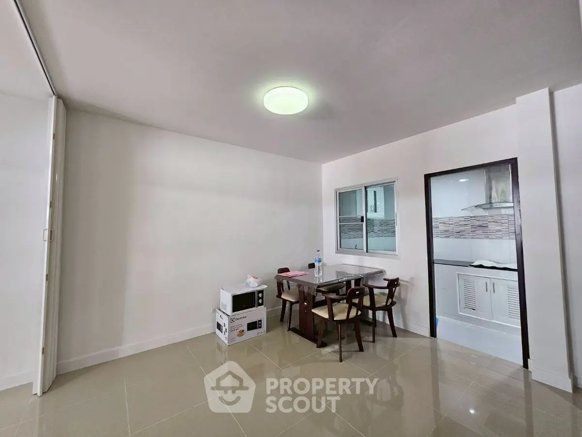 Spacious dining area with modern furniture and tiled flooring