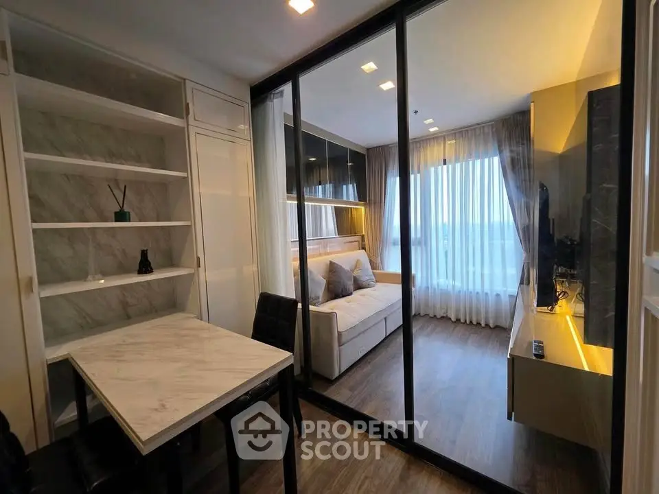 Modern living room with glass partition and stylish decor