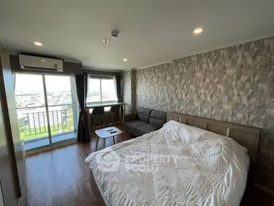 Spacious bedroom with balcony and stunning city view