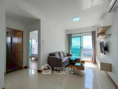 Bright living room with modern furniture and balcony view