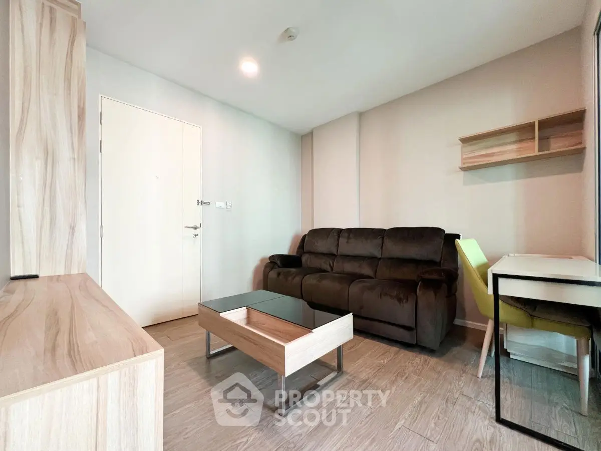Modern living room with cozy sofa and stylish wooden furniture