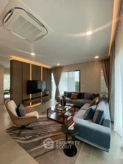 Luxurious living room with modern decor, plush seating, and ambient lighting for ultimate comfort and style.