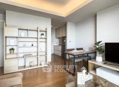 Modern living room with open kitchen and stylish decor