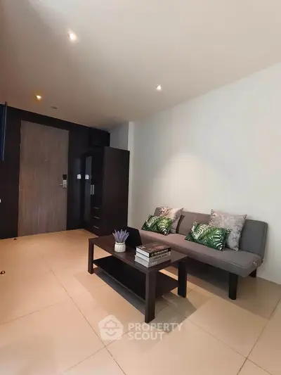 Modern living room with sleek furniture and stylish decor in a contemporary apartment.