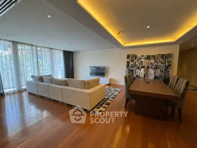 Spacious living room with modern decor and large windows for natural light.