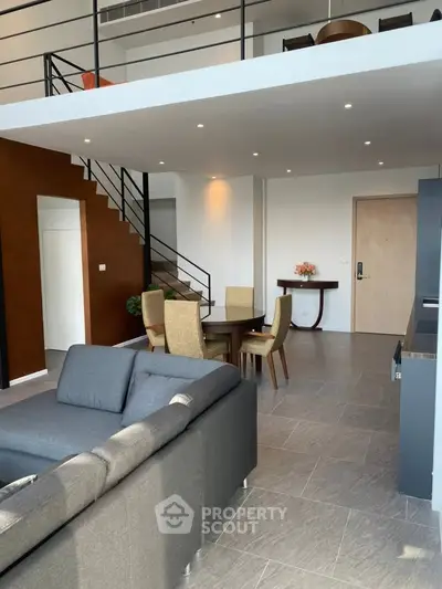 Modern duplex living room with stylish furniture and open layout
