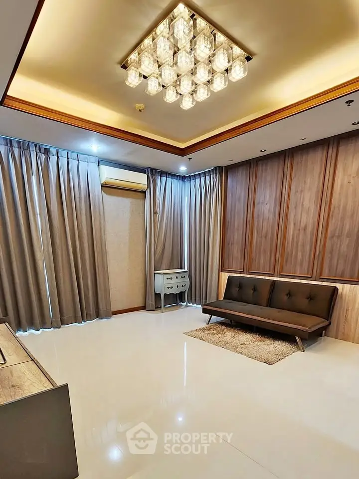 Luxurious living room with elegant chandelier and modern furnishings