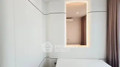 Modern minimalist bedroom with sleek white walls and ambient lighting