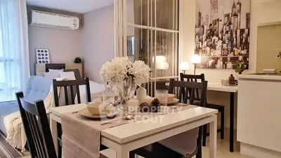 Modern open-plan living and dining area with stylish decor and natural light.