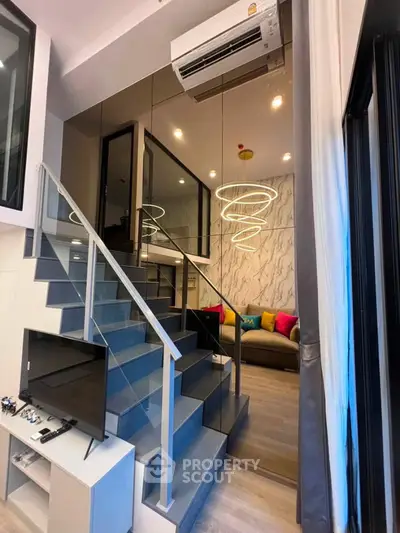 Modern duplex living room with stylish staircase and vibrant decor