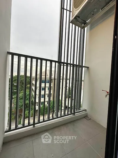 Modern balcony with sleek railing and city view, perfect for urban living.