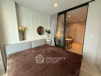 Modern bedroom with glass partition and cozy decor