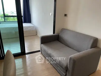 Modern apartment with cozy living room and bedroom view