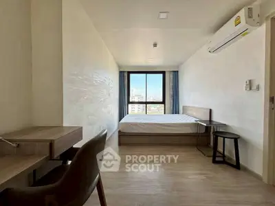 Modern minimalist bedroom with city view and air conditioning