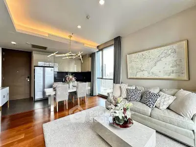 Luxurious modern living room with elegant decor and city view, featuring open kitchen and stylish furniture.