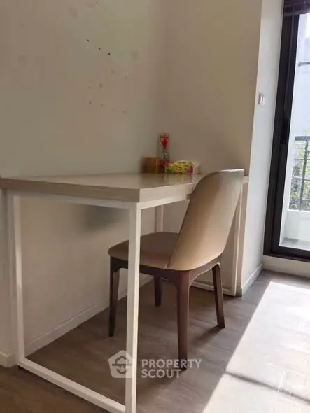 Cozy study nook with natural light and modern furniture.