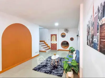 Modern living room with unique circular windows and stylish decor