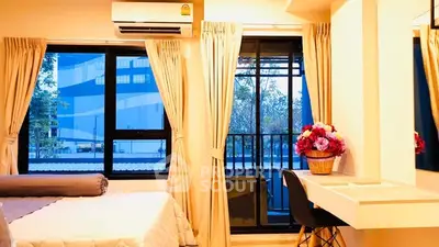 Cozy bedroom with balcony view and modern decor