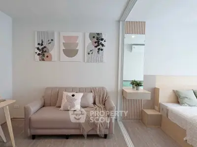 Modern living room with stylish decor and cozy sofa in a contemporary apartment.