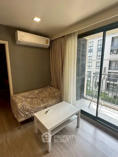 Modern living room with balcony view in urban apartment