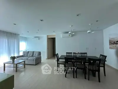 Spacious modern living room with dining area and elegant furnishings