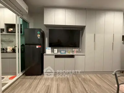 Modern kitchen with sleek cabinetry and integrated appliances in a stylish apartment.