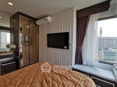 Modern bedroom with city view, featuring elegant decor and large windows for natural light.