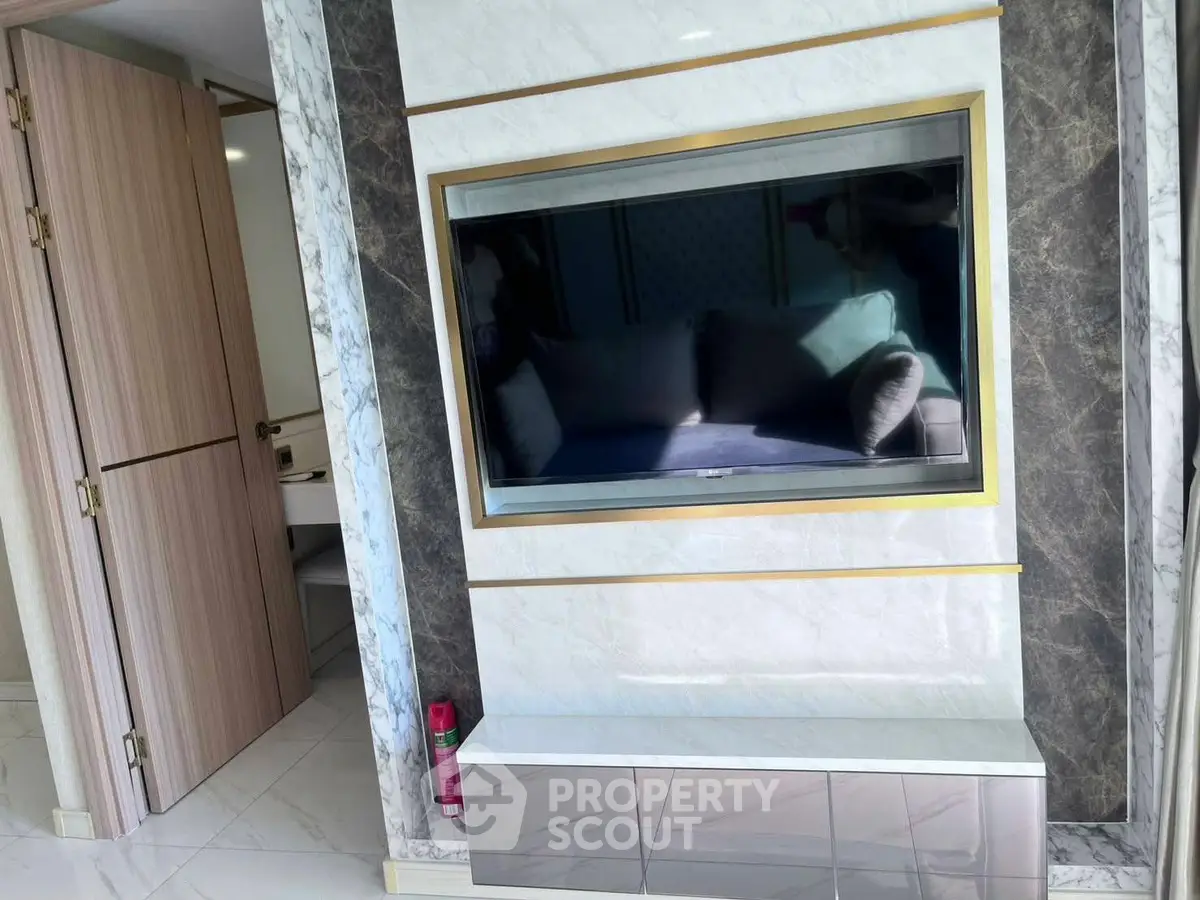 Luxurious modern living room with elegant marble TV wall and sleek design