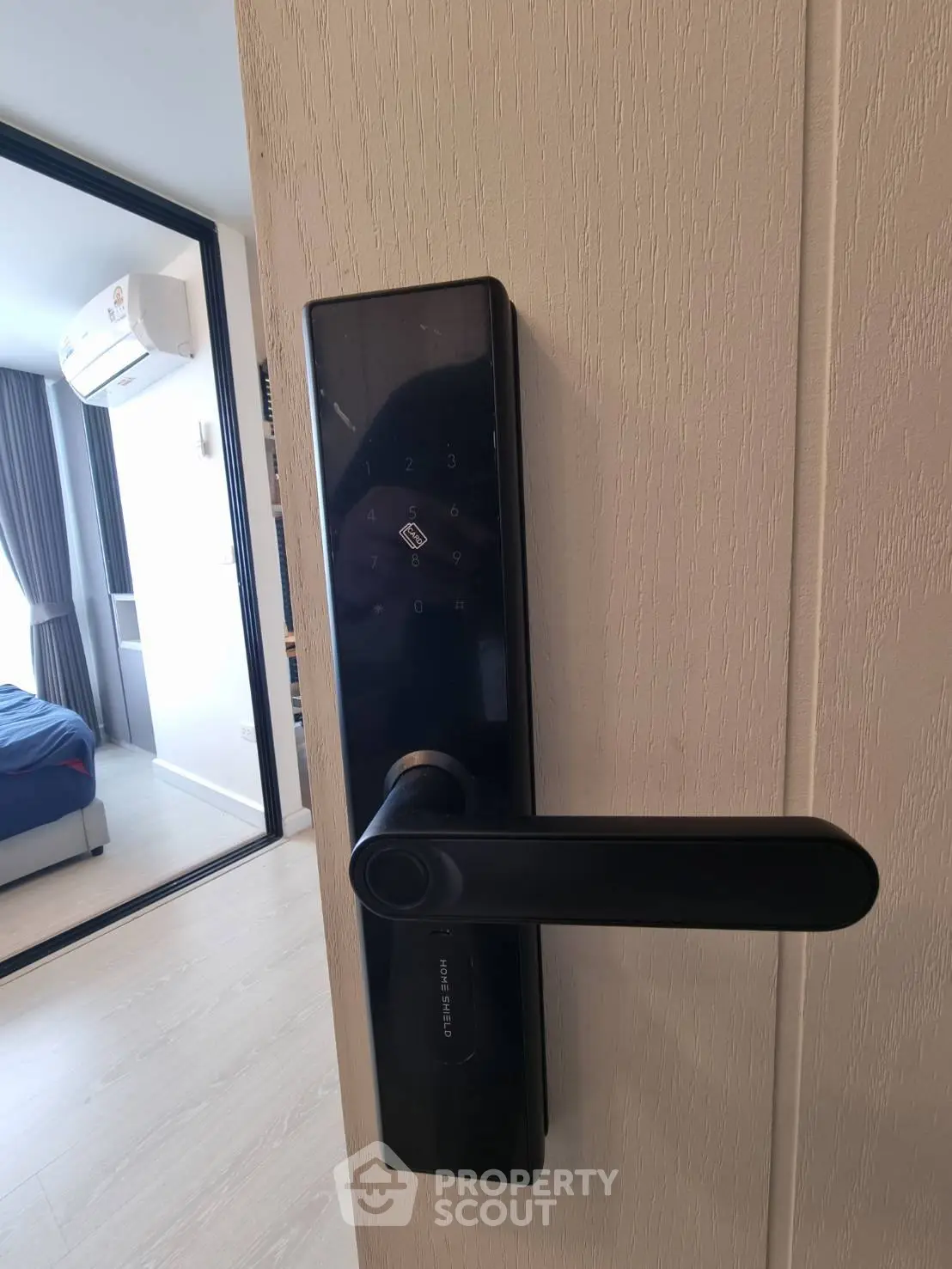Modern smart lock on a bedroom door with sleek design and advanced security features.