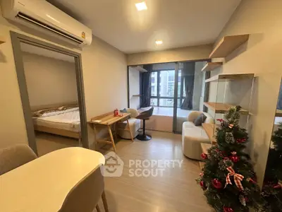 Modern apartment living room with festive decor and cozy furnishings