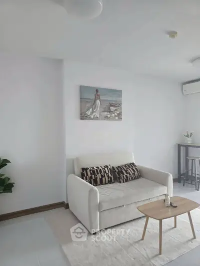 Modern living room with cozy sofa and stylish decor