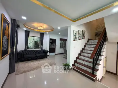 Spacious modern living room with elegant staircase and stylish decor