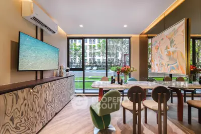 Luxurious modern living room with elegant dining area and large windows overlooking a lush garden.