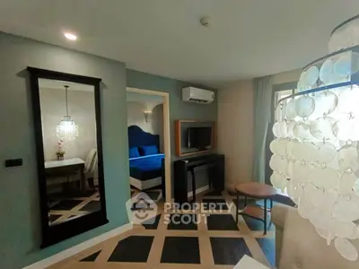 Stylish living room with modern decor and unique flooring in a cozy apartment.