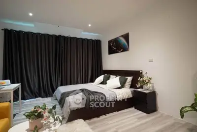 Modern bedroom with cozy decor and stylish curtains