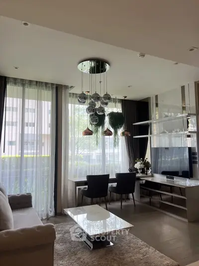 Luxurious living room with modern decor, large windows, and elegant lighting in a high-end apartment.