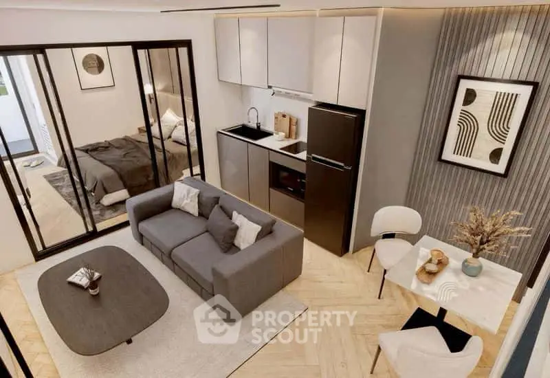 Modern open-plan living room with sleek kitchen and stylish decor