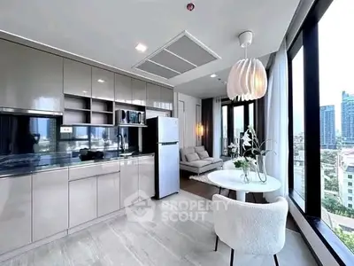 Modern open-layout kitchen with dining area and city view in luxury apartment