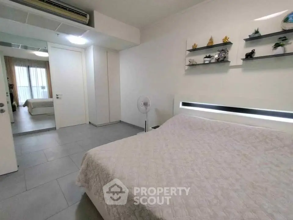 Modern bedroom with sleek design and decorative shelves