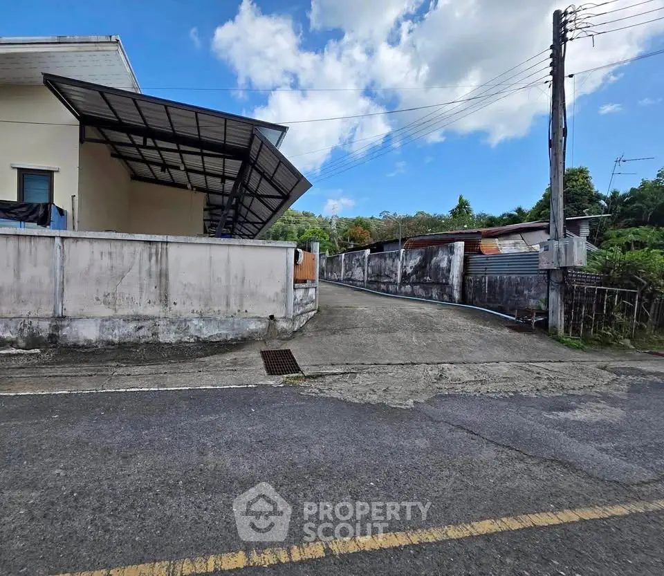 Spacious property with driveway and modern exterior, ideal for development opportunities.