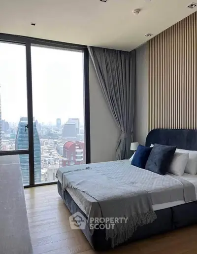 Luxurious bedroom with stunning city view and modern decor