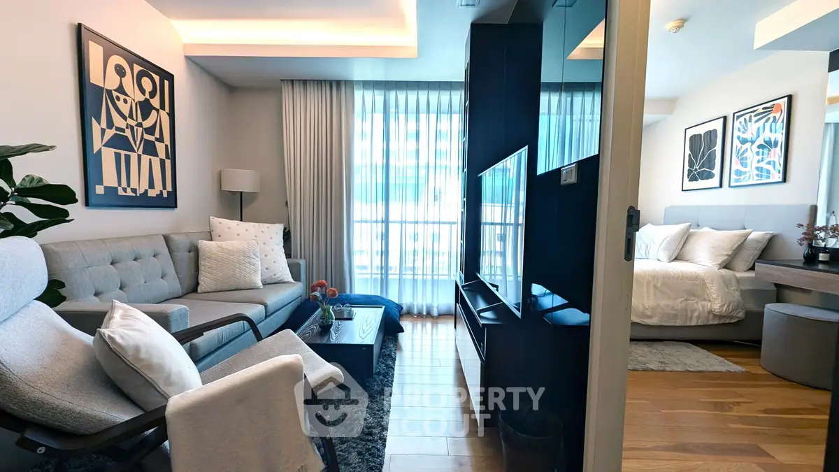 Modern open-plan living room with stylish decor and natural light