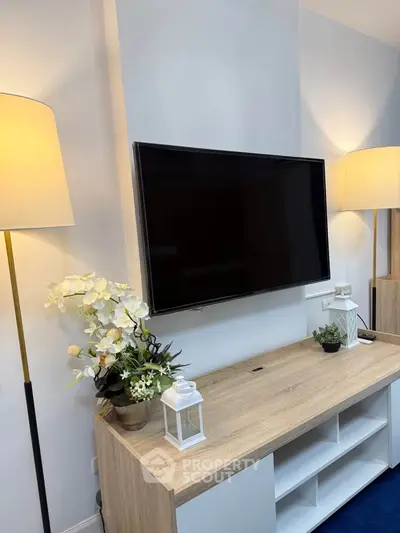 Modern living room with stylish TV setup and elegant decor